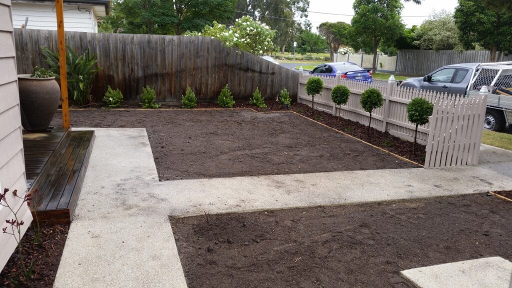 Front garden beds with topiary planting and decorative urn, Bacchus Marsh